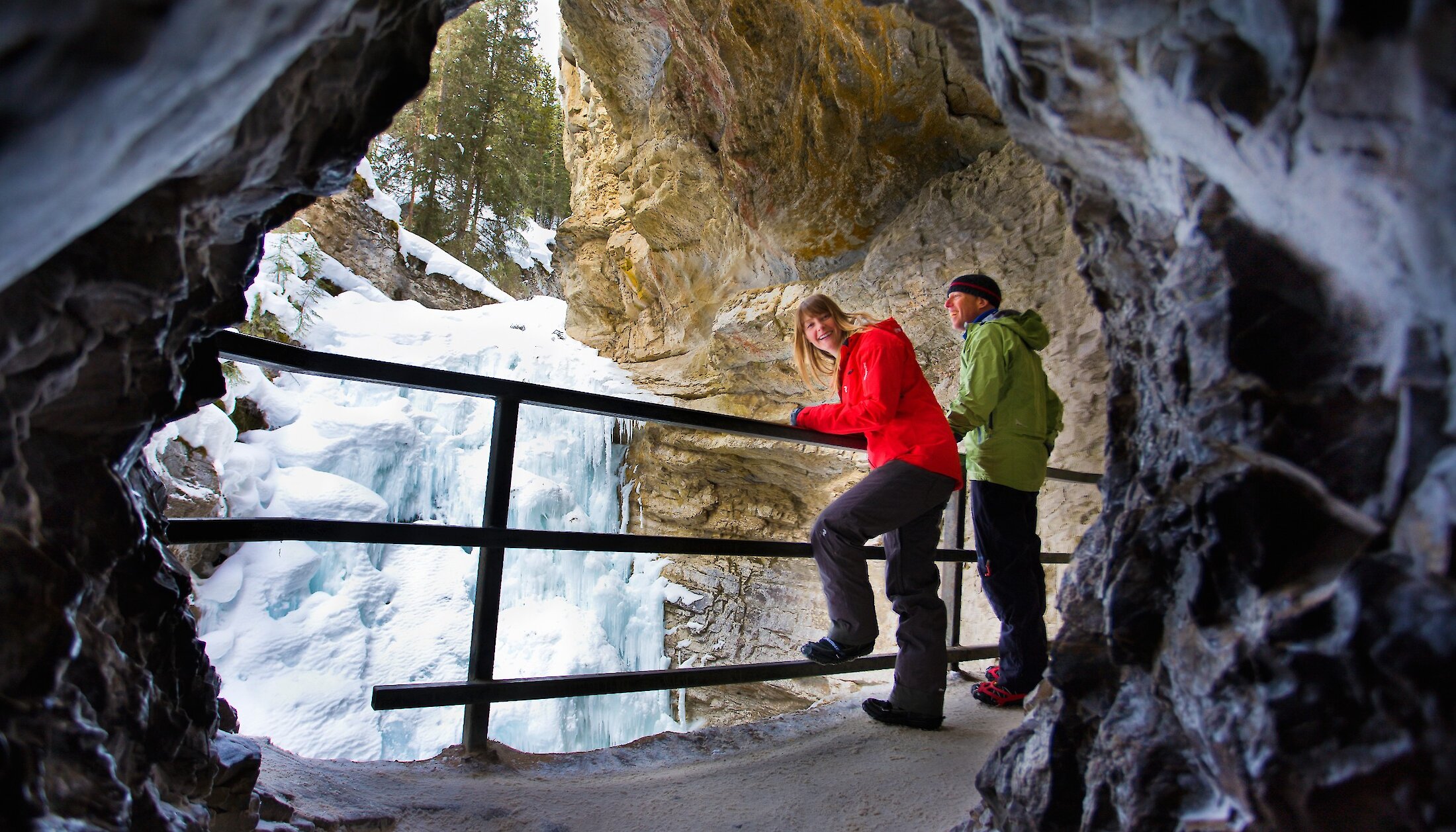 Couple in the ice cave at Johnston Canyon in Banff National Park