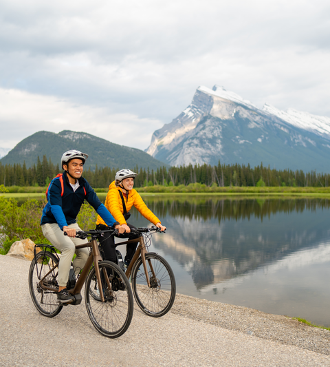 Bike riding in Banff National Park with views of Mount Rundle