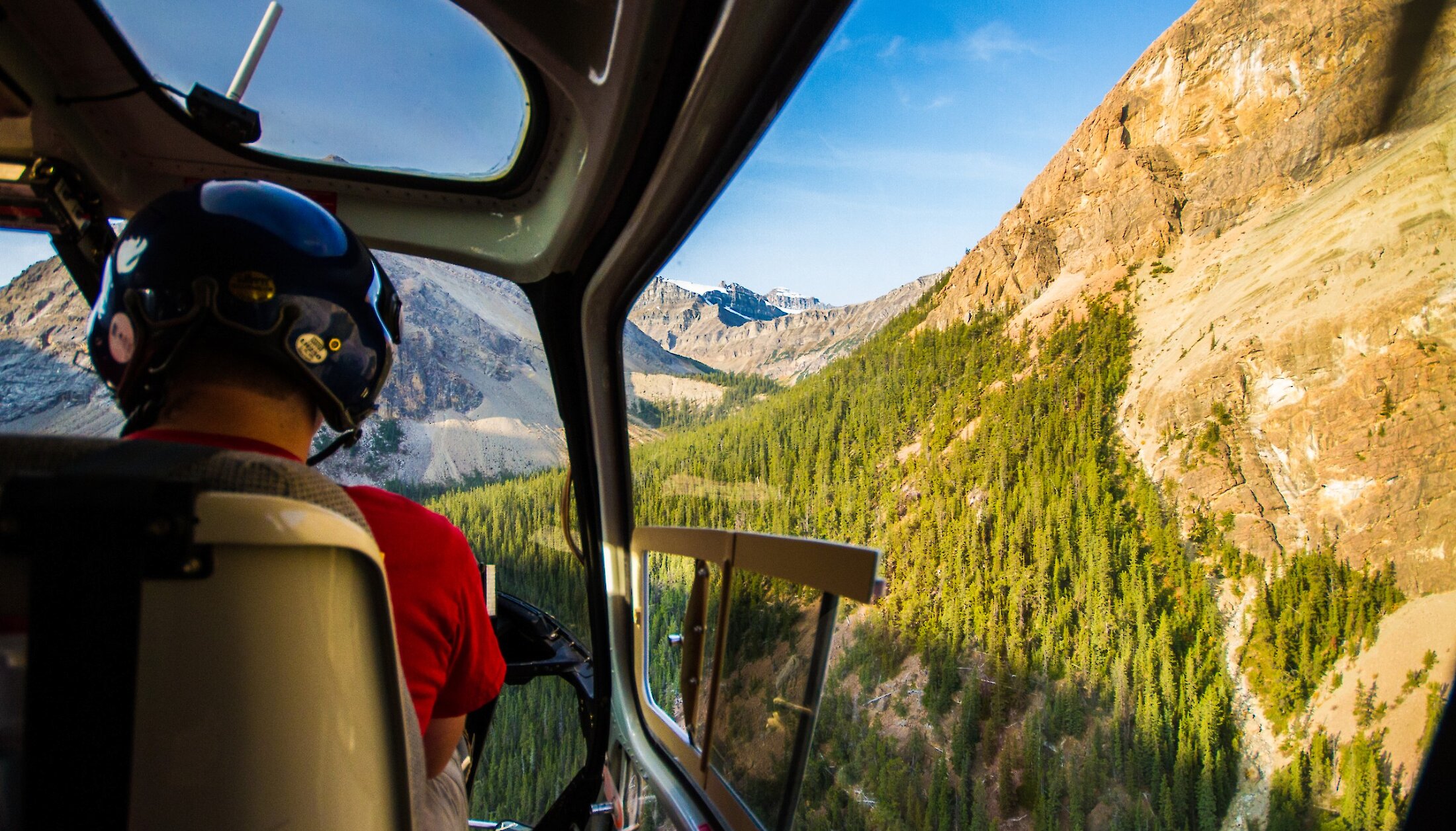Get a bird's eye view of the Rocky Mountains from a helicopter