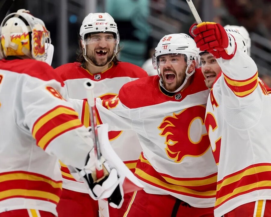 Calgary Flames Hockey players celebrating a goal at the Scotiabank Saddledome in Calgary