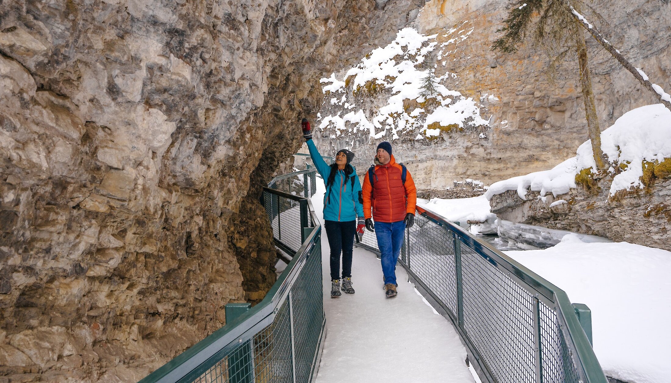 Couple walking the trails in Johnston Canyon