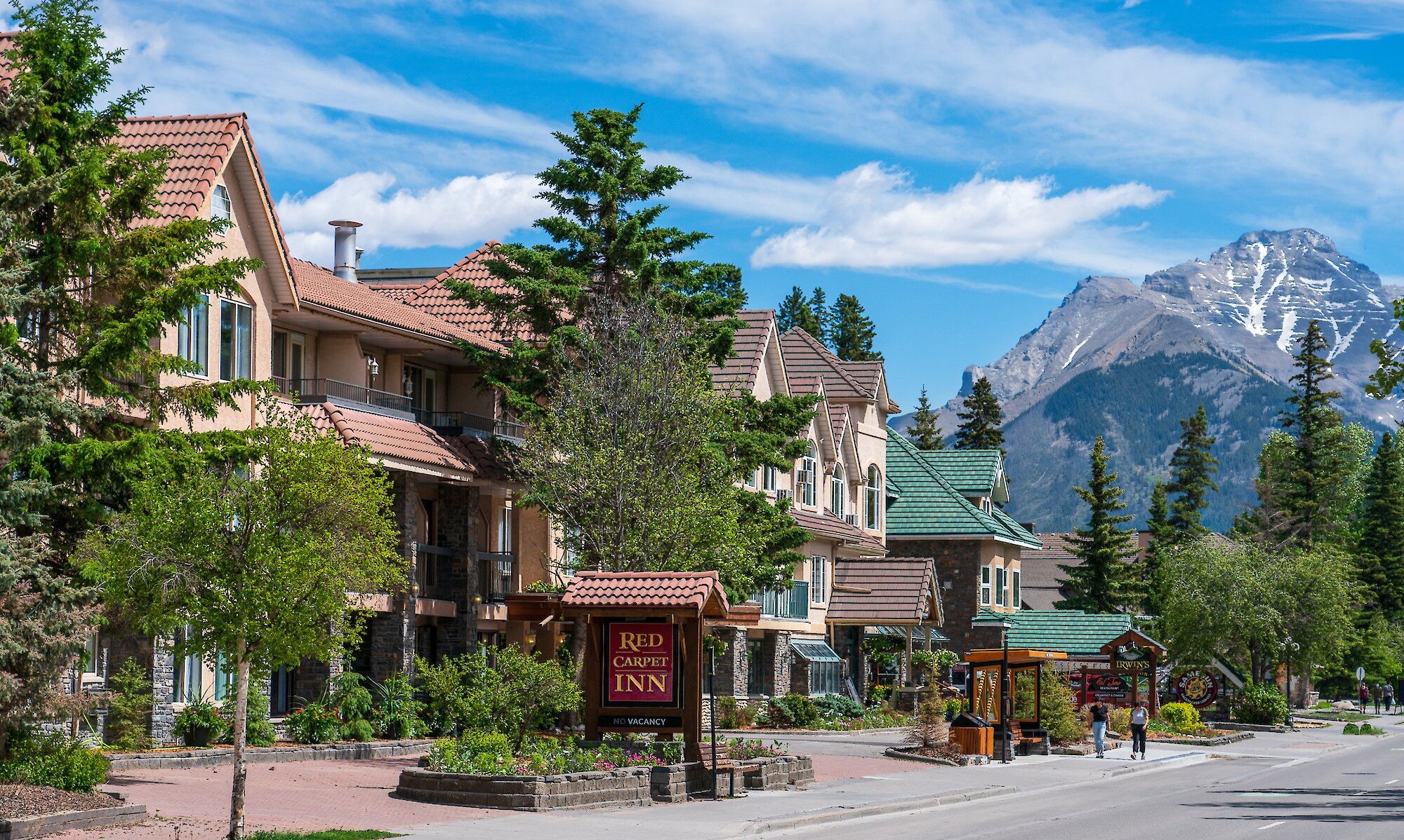 Exterior of Red Carpet Inn in summer