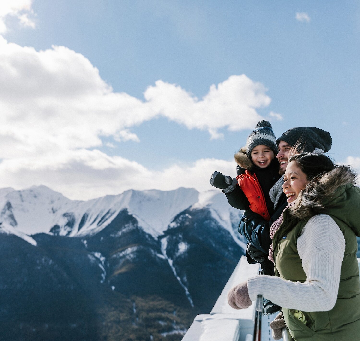 A family enjoying the views from the top of the Banff Gondola in winter