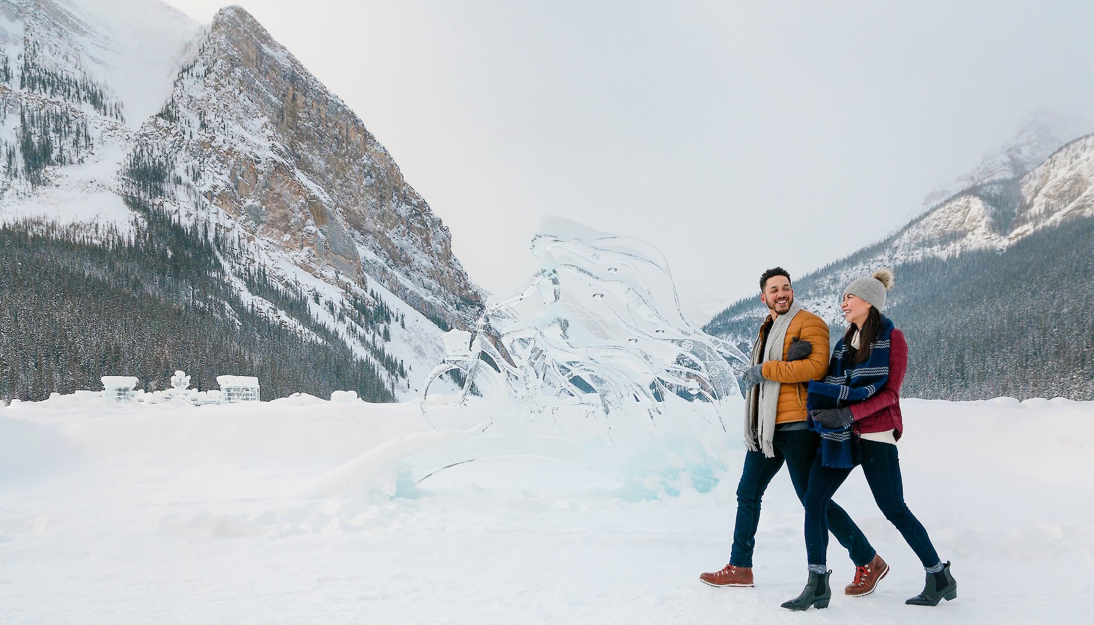 Guests checking out the ice carvings at Lake Louise in winter