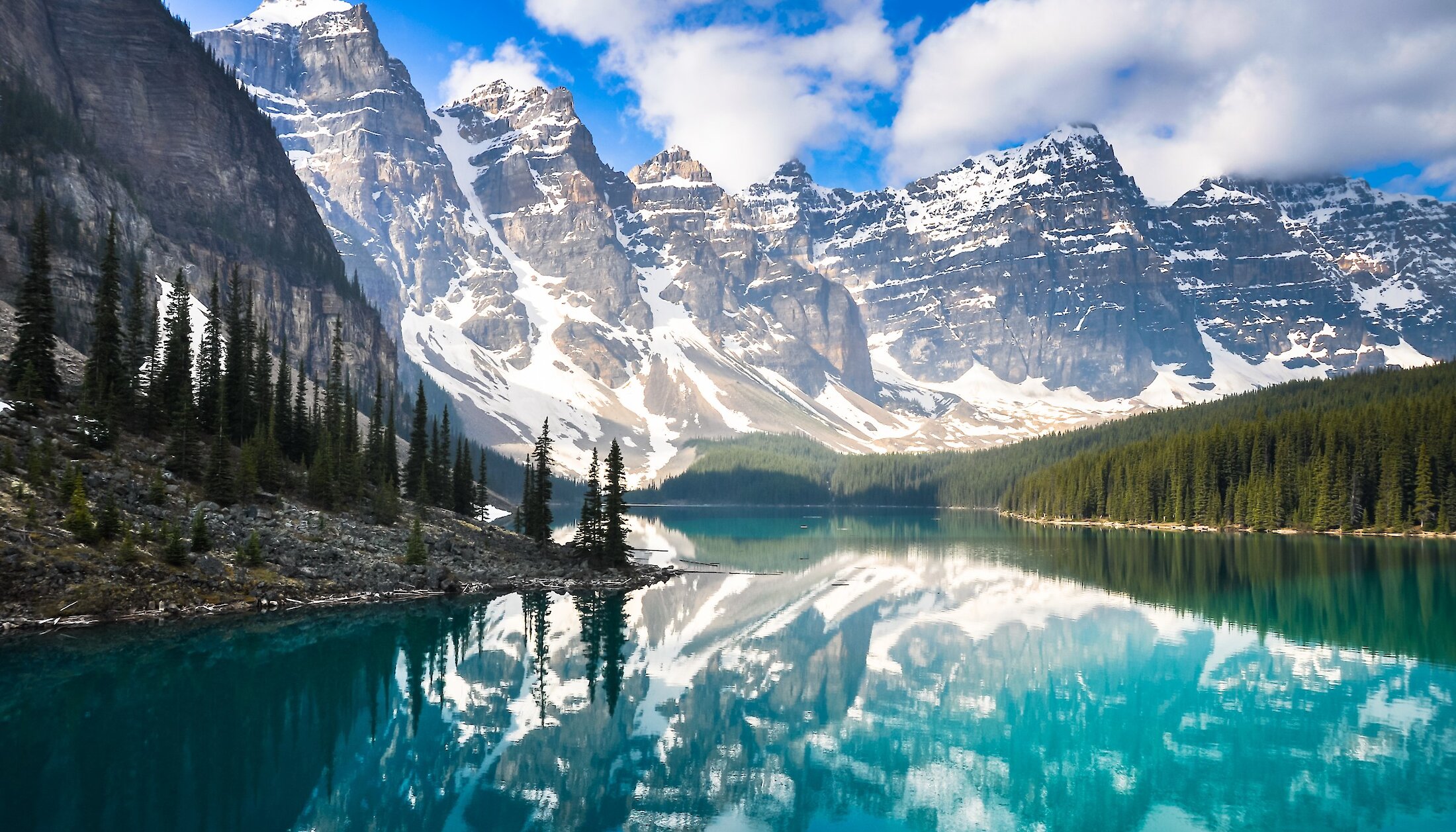 Friends overlooking Lake Louise through a view finder