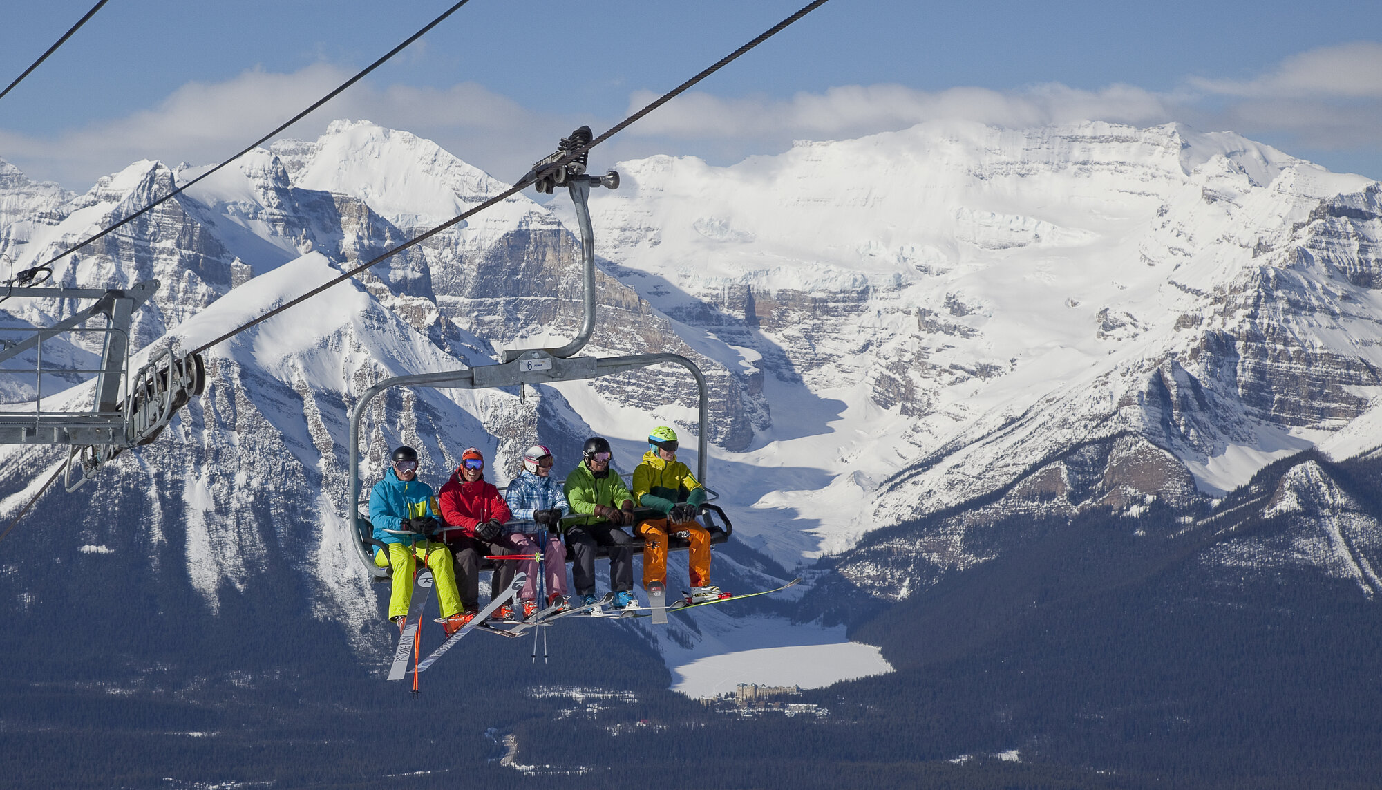 Skiers on a chairlift at Lake Louise Ski Resort