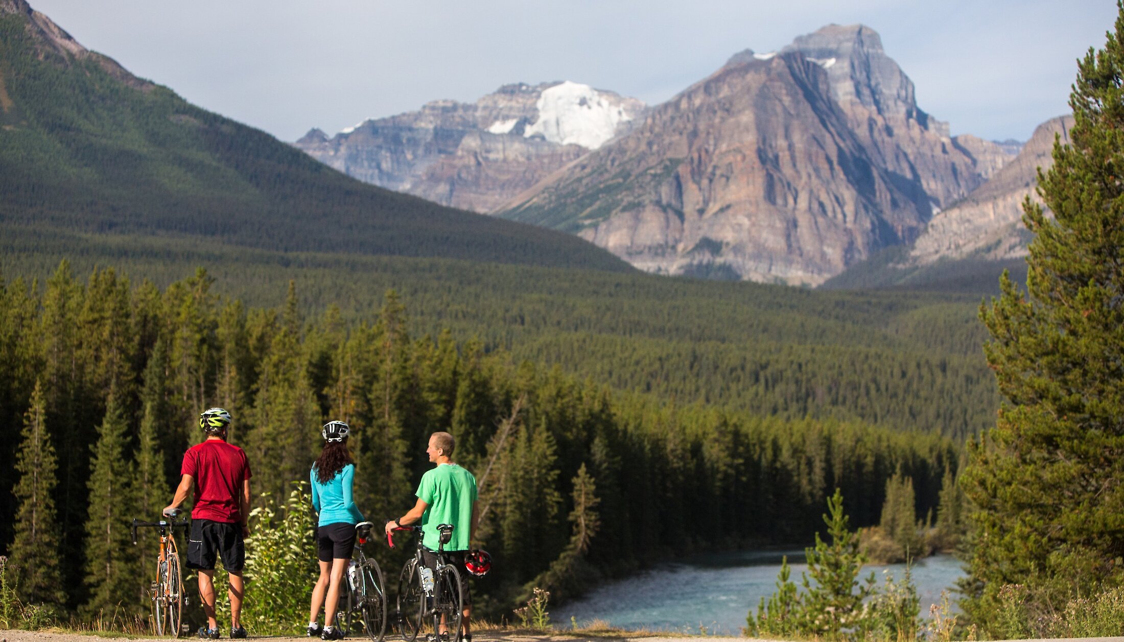 Bikers stop to check out the view during a bike ride in Banff