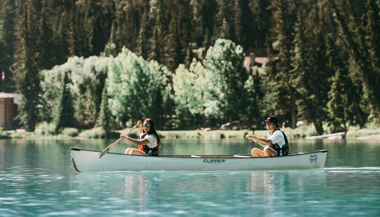 Paddling up the Bow river in a canoe