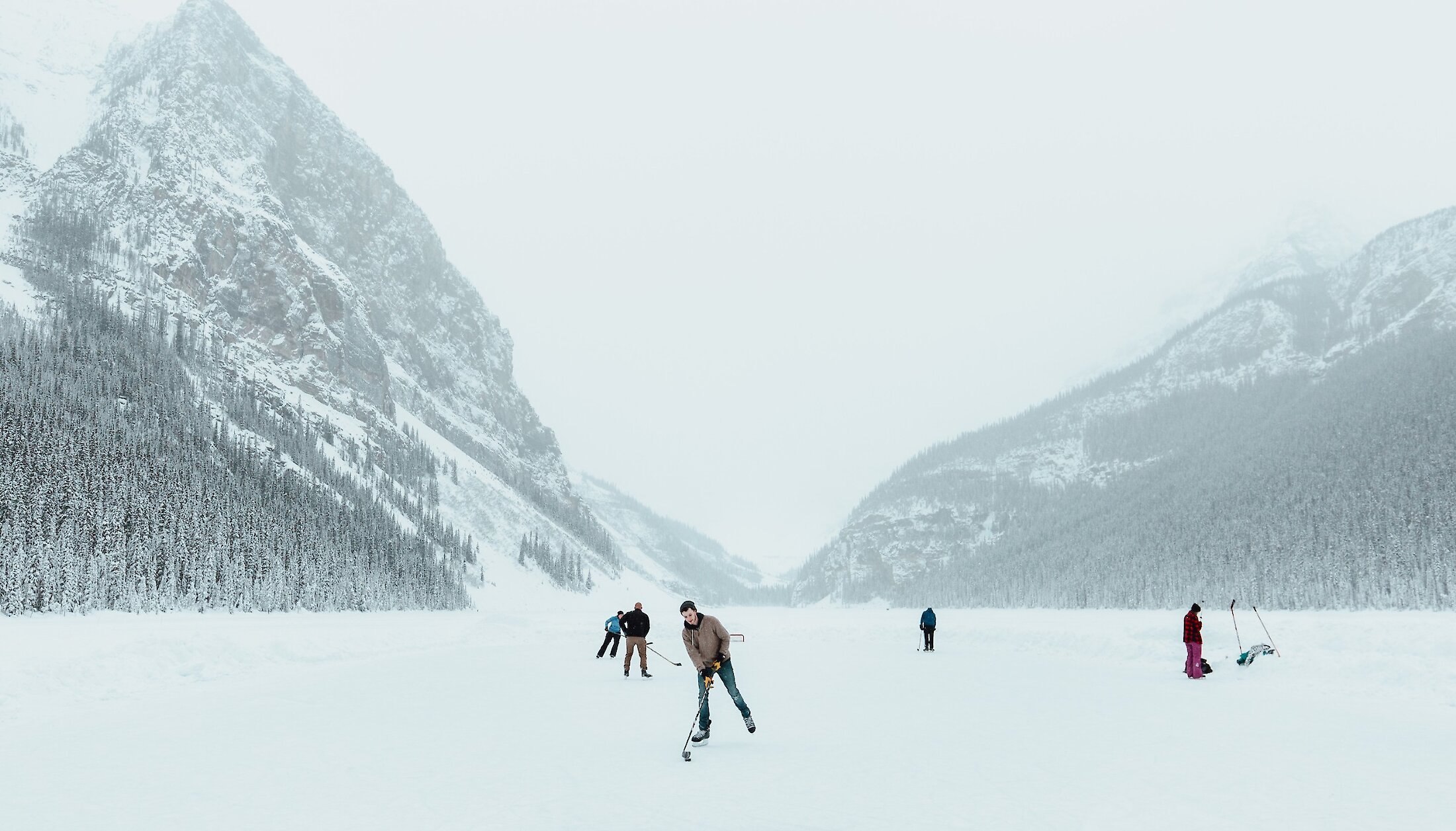 Enjoying a friendly game of sticks and pucks at Lake Louise (with rental skates)