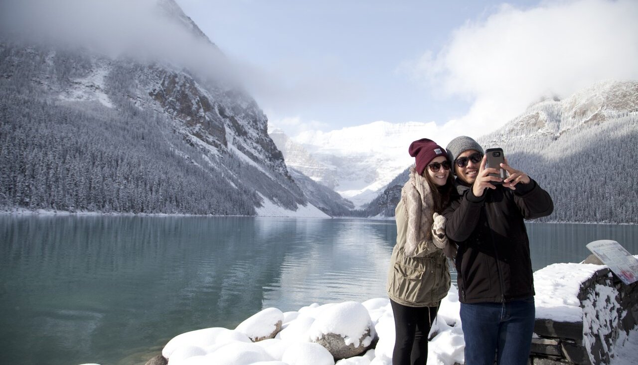 Getting a couple selfie with Lake Louise in the background
