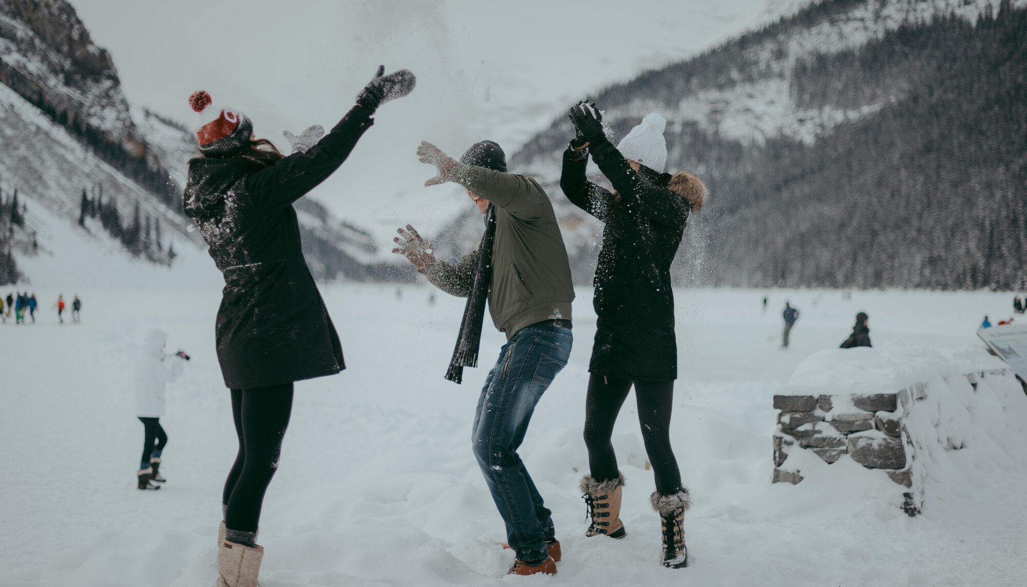 Friends having fun in the snow at Lake Louise