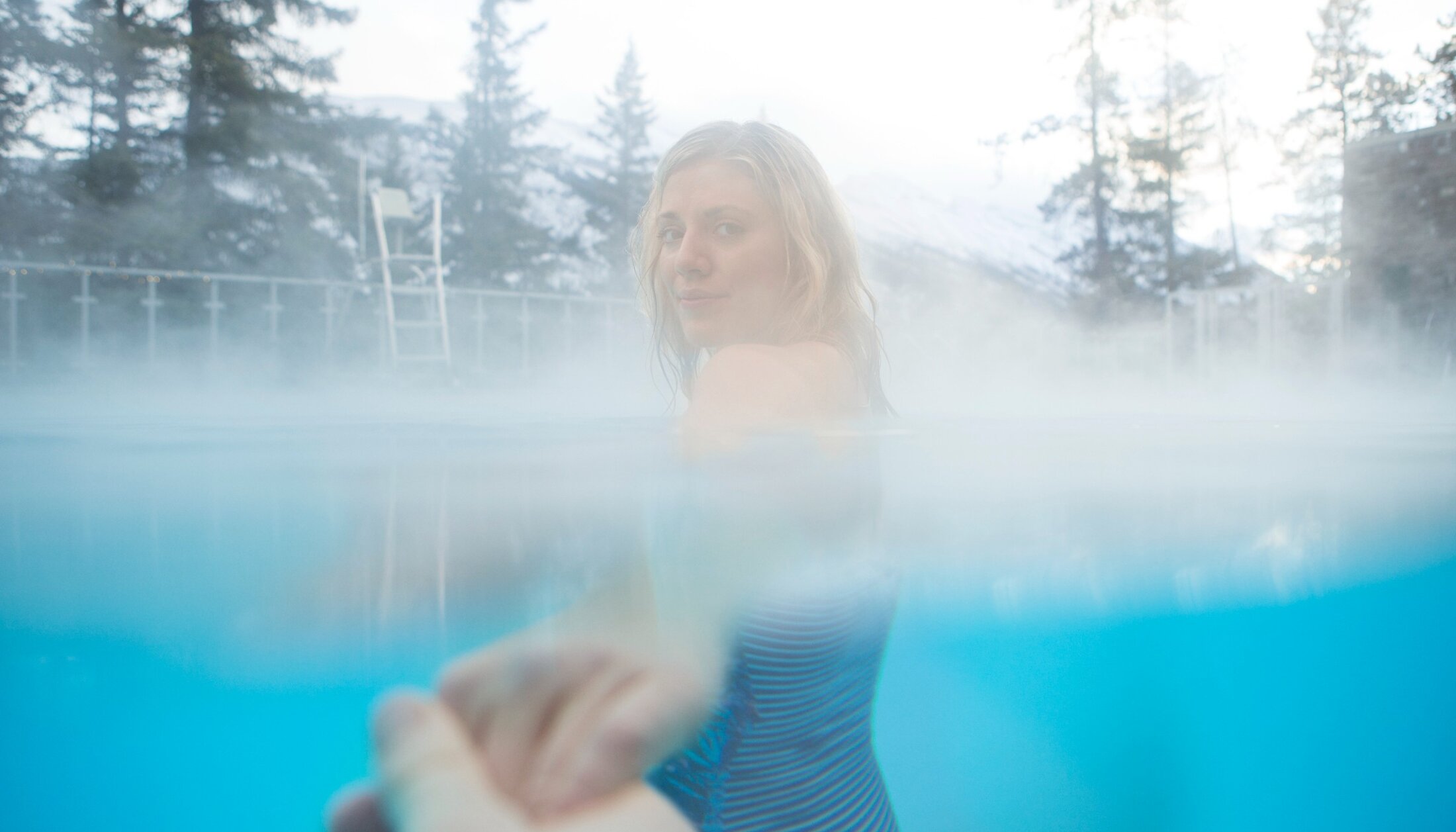 Women bathing in Banff Hot Springs with Partner enjoying hot mineral water