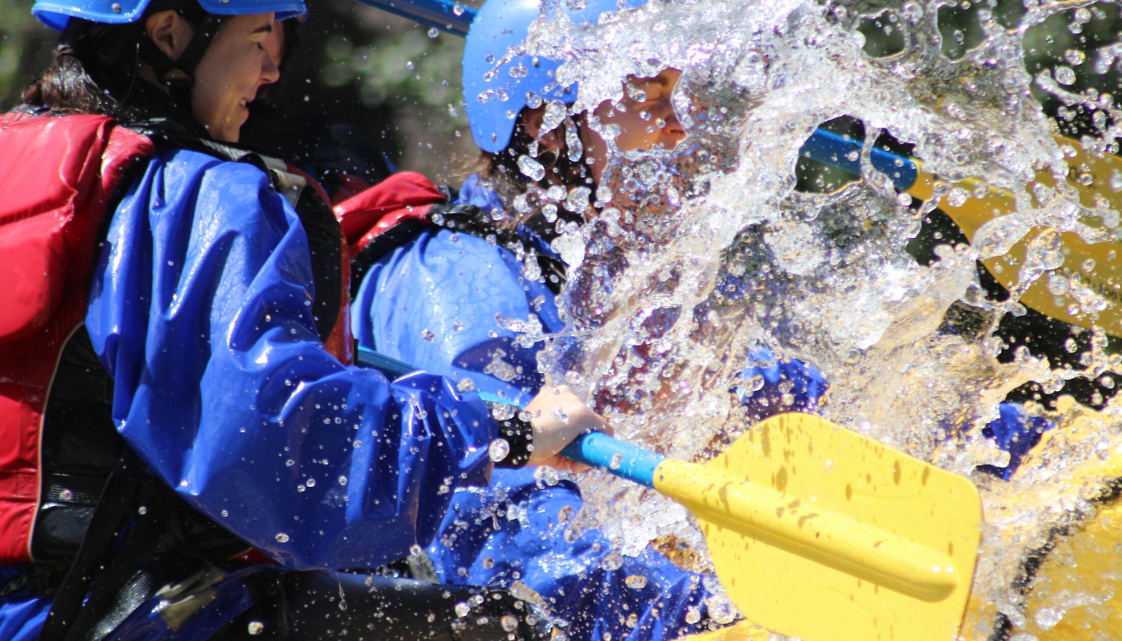 A big splash of cold Kananaskis river water on the raft