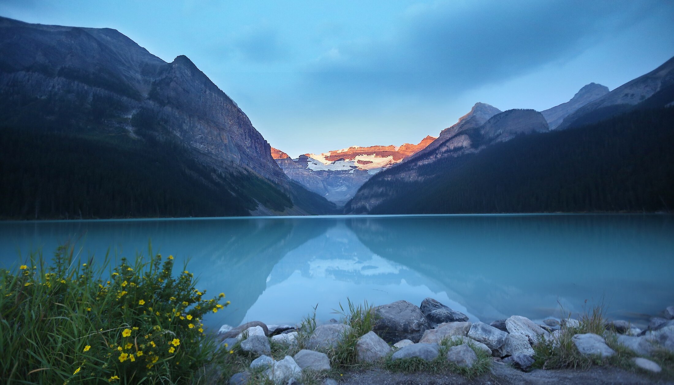The sunrises over the magnificent Victoria Glacier at Lake Louise in Banff National Park