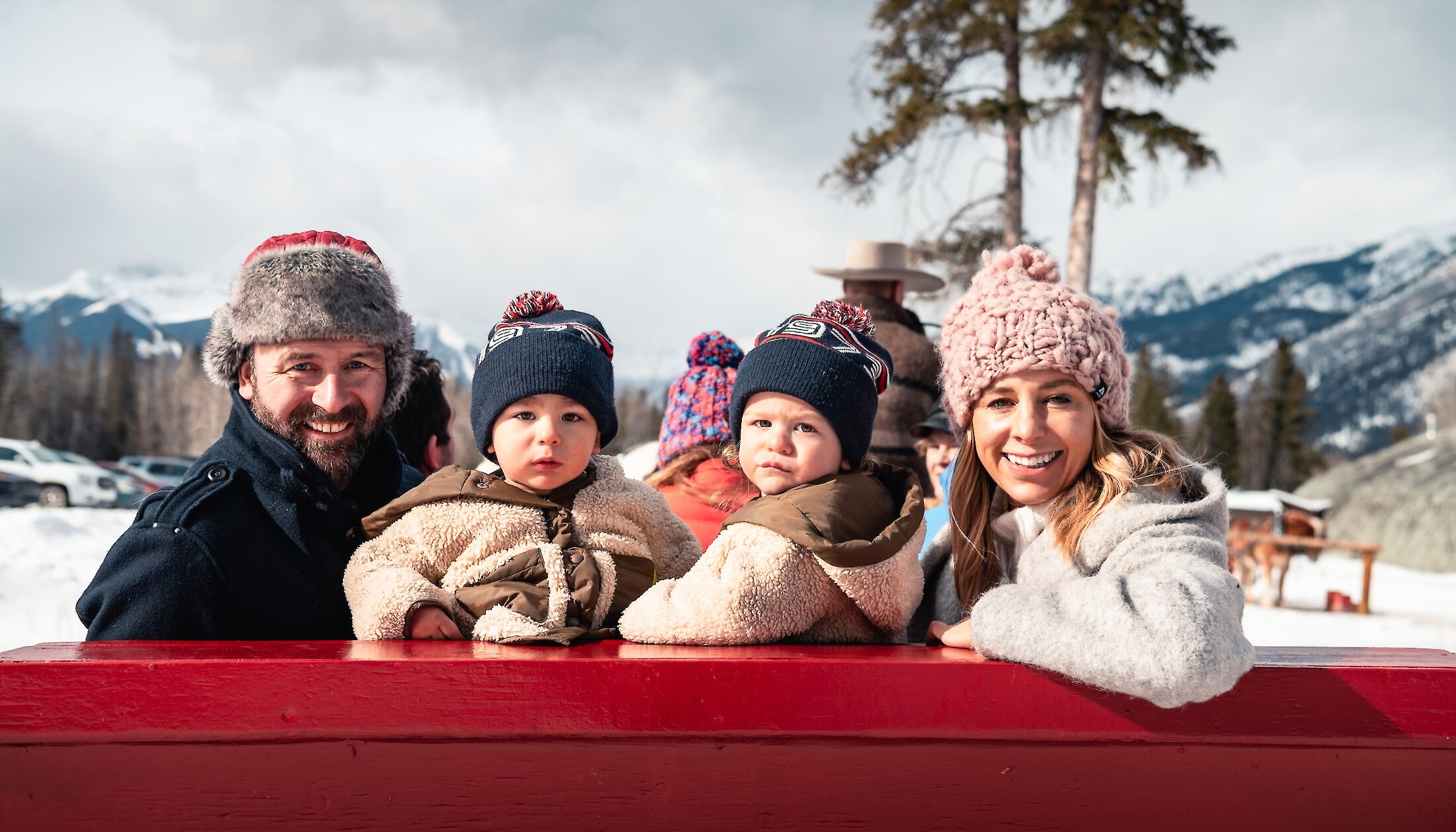 Family photo enjoying the sleigh ride through the Meadows of Banff