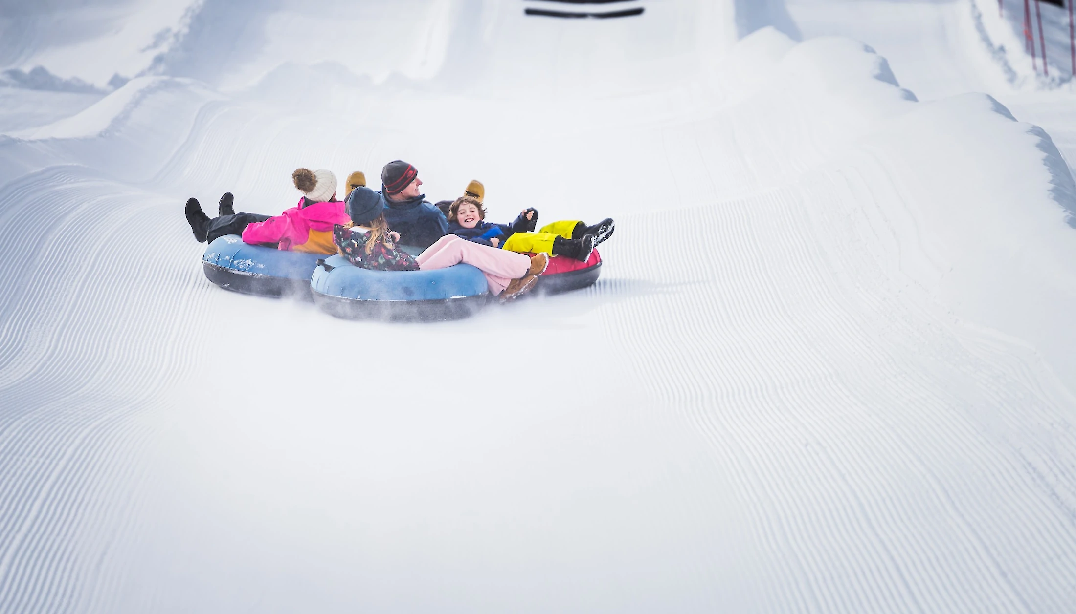 A family snow tubing in Lake Louise