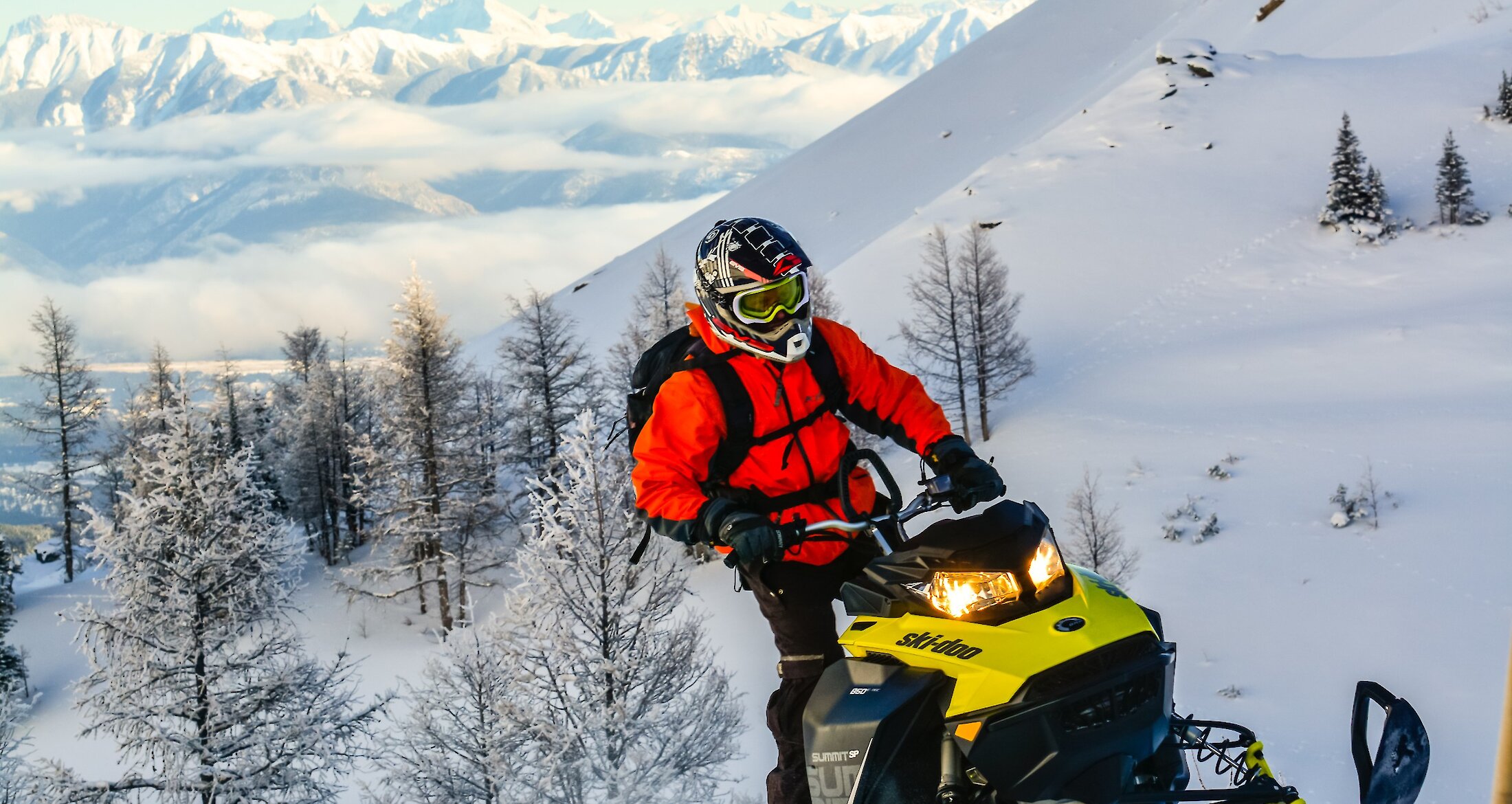 Snowmobile and rider in Panorama
