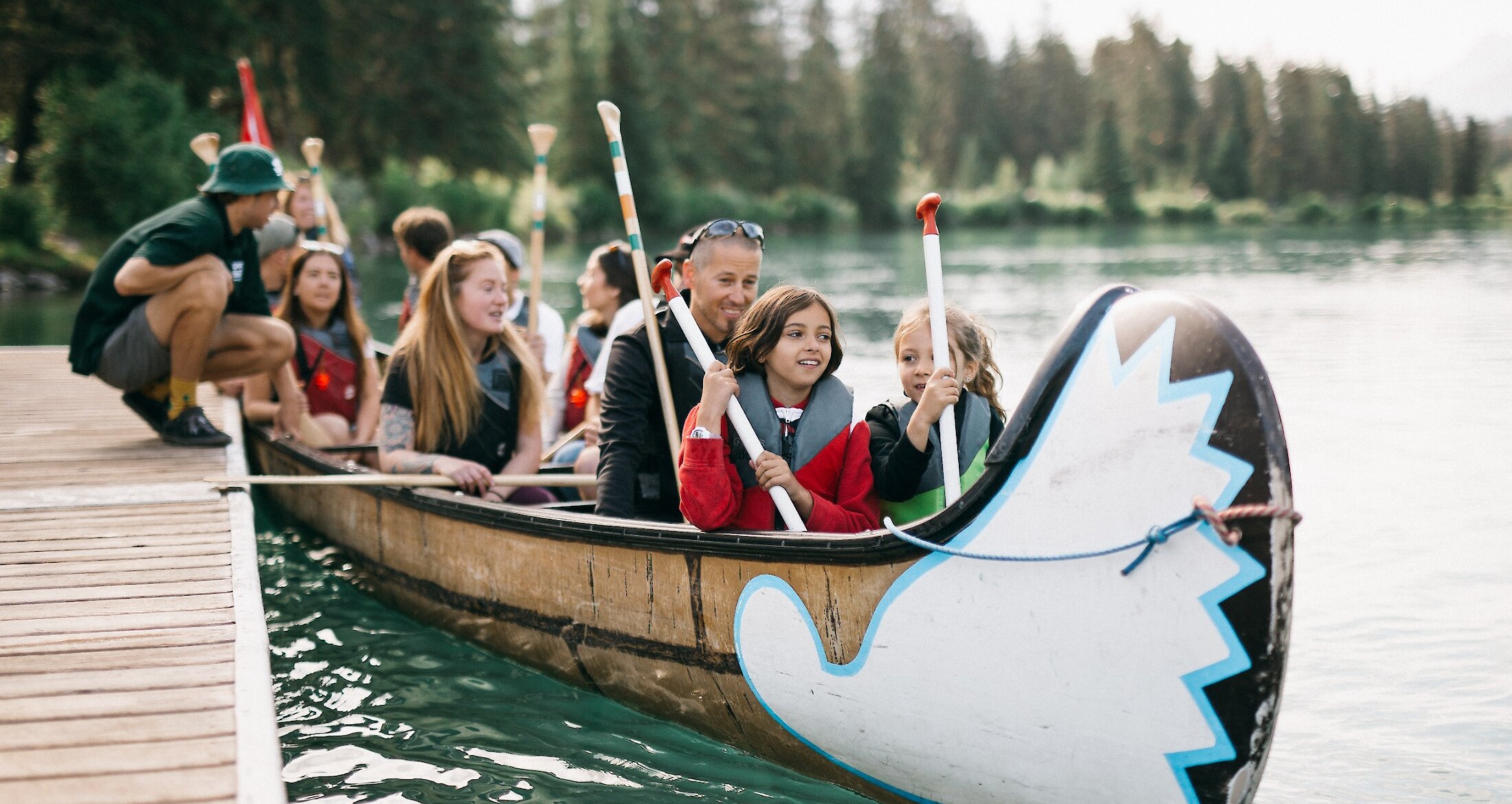 Children with their parents enjoying the Big Canoe Tour in Banff National Park