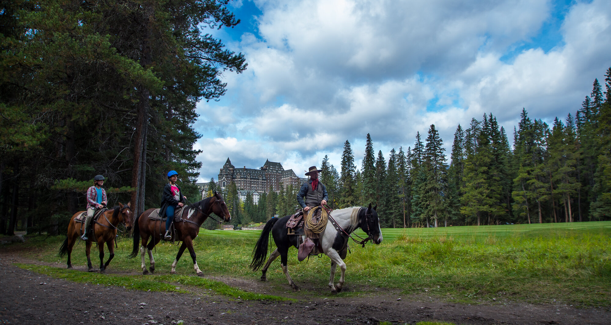 Horseback Riders on the golf course of the Banff Springs Hotel