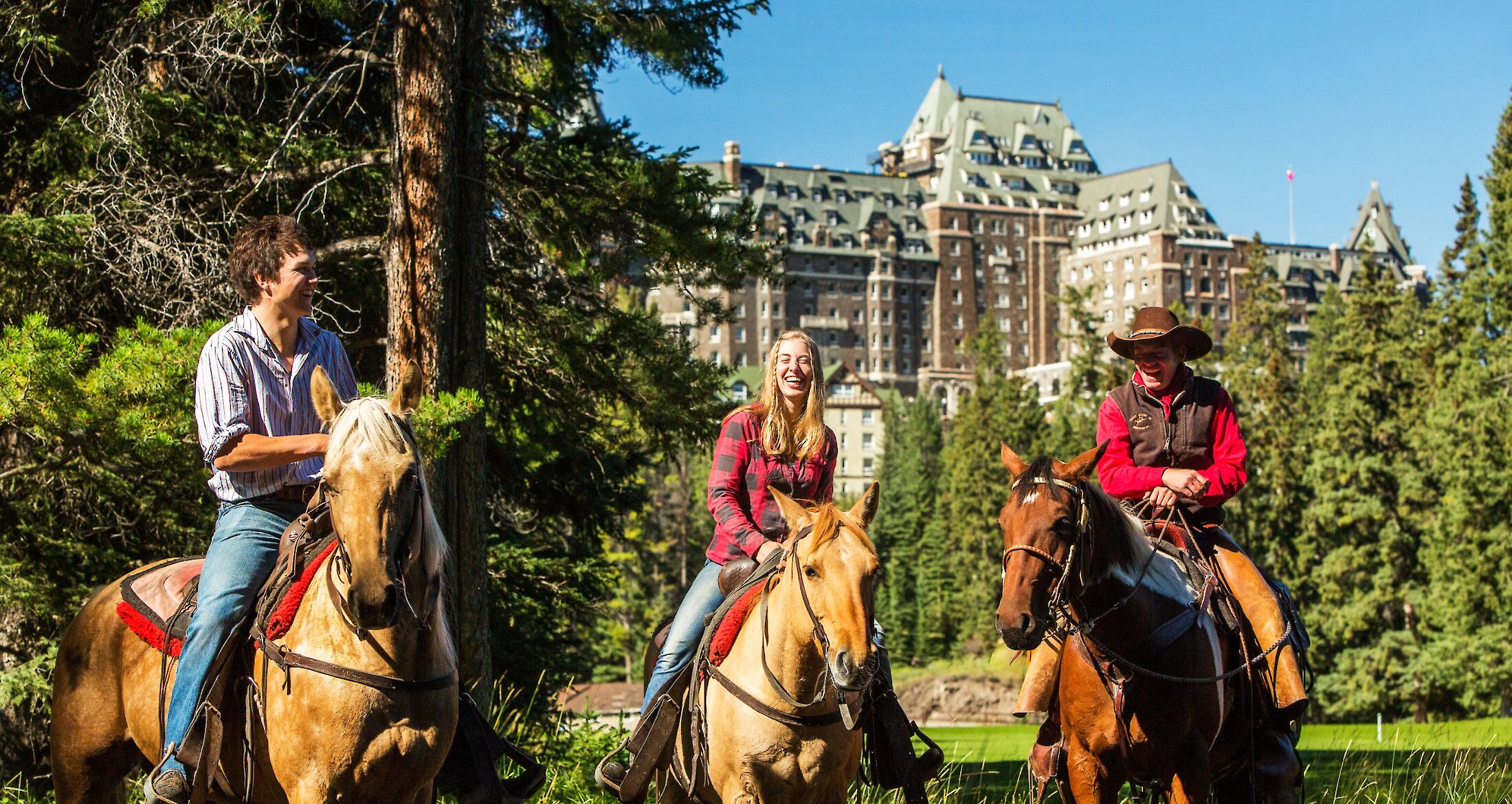 Horseback riders outside the Banff Springs Hotel