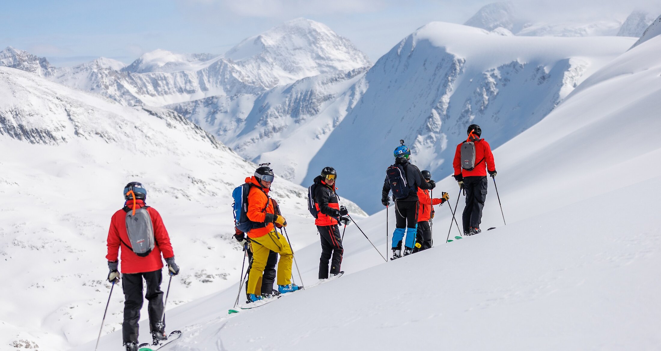 A group of skiers heli-skiing in the Purcell Mountains