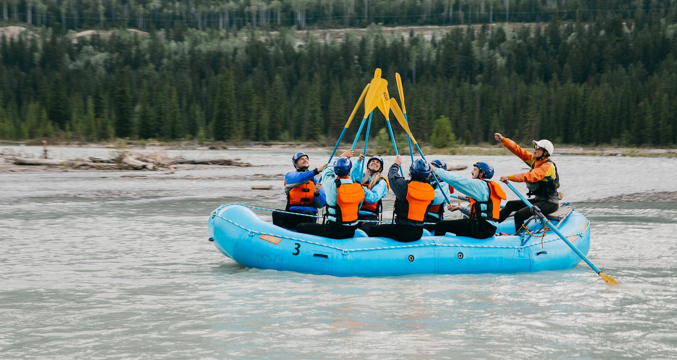 A raft floating on the Kicking Horse River before the rapids