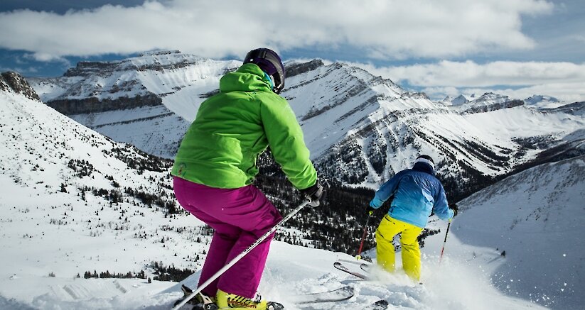 A couple skiing at Lake Louise