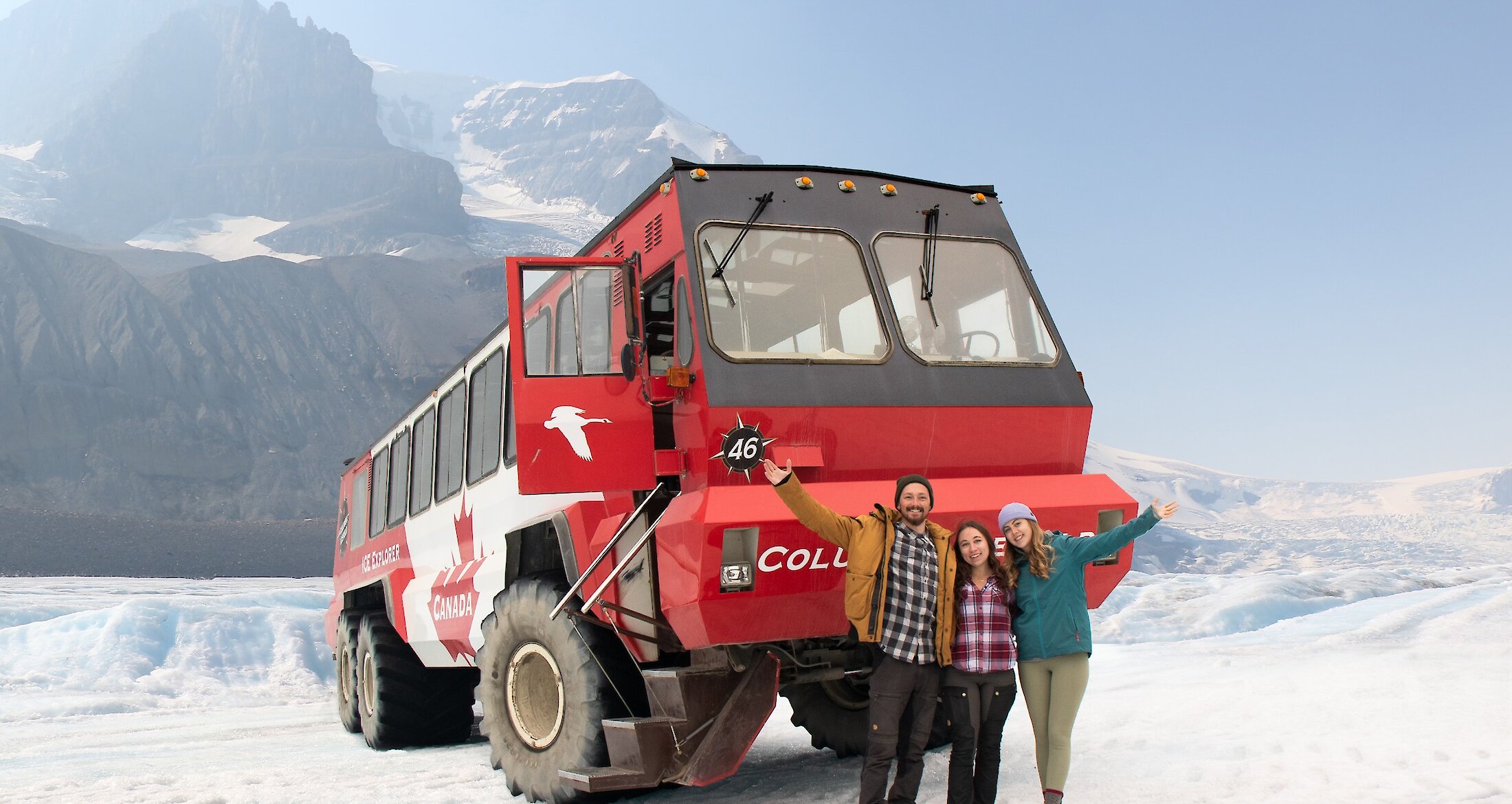 Guests in front of an Ice Explorer on the Columbia Icefields Glacier