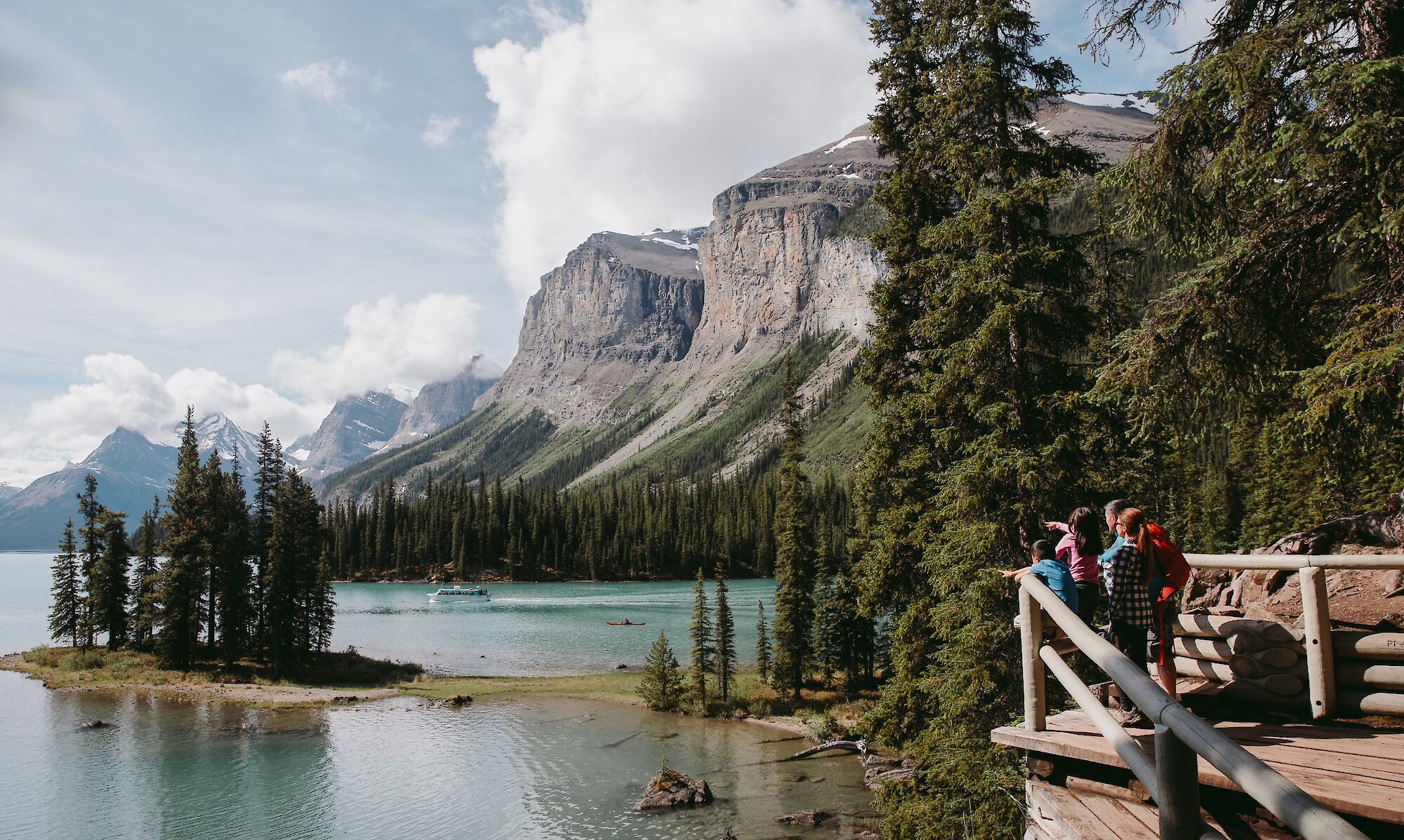 A family viewing Spirit Island at Maligne Lake on Spirit Island