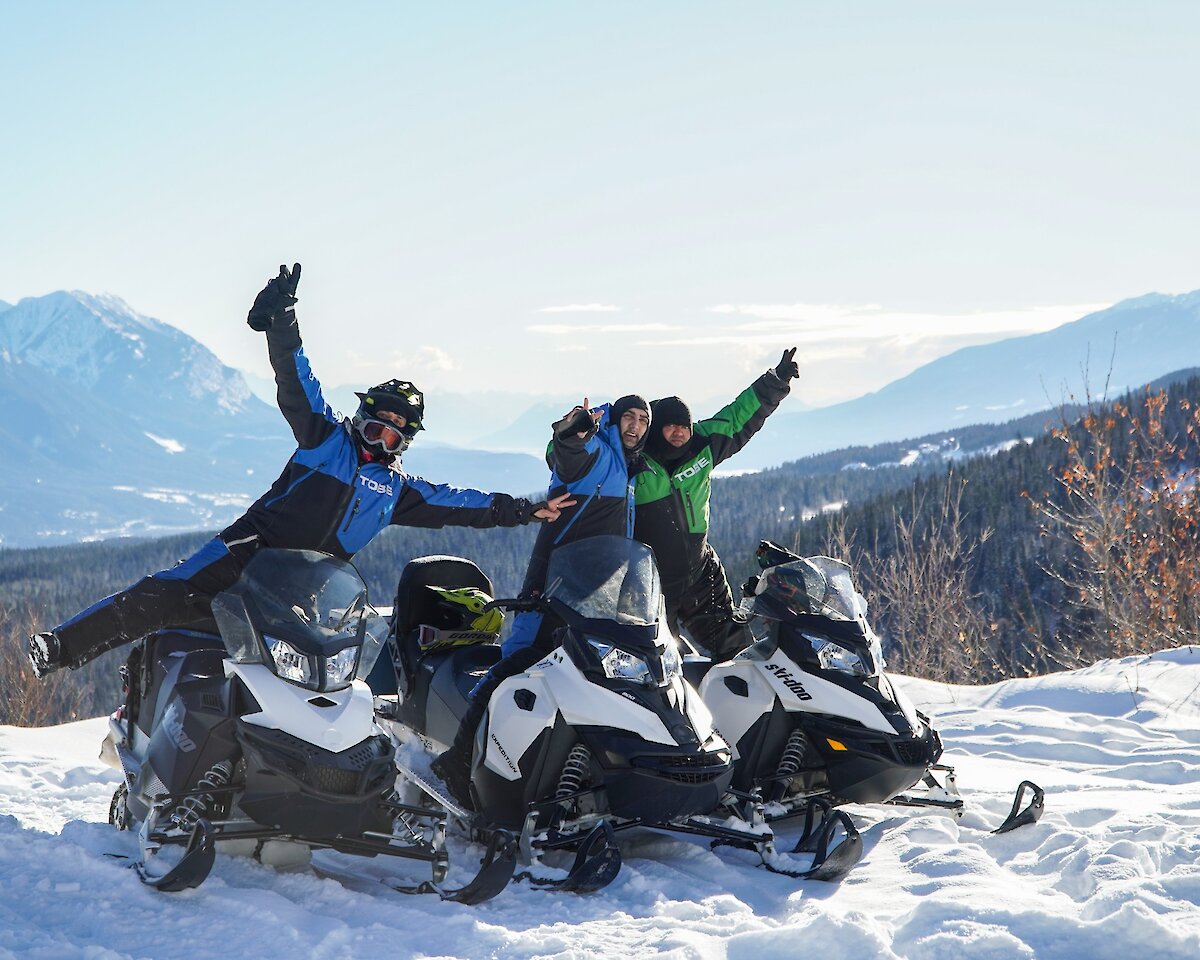 A group of friends enjoying snowmobiling in Golden, BC