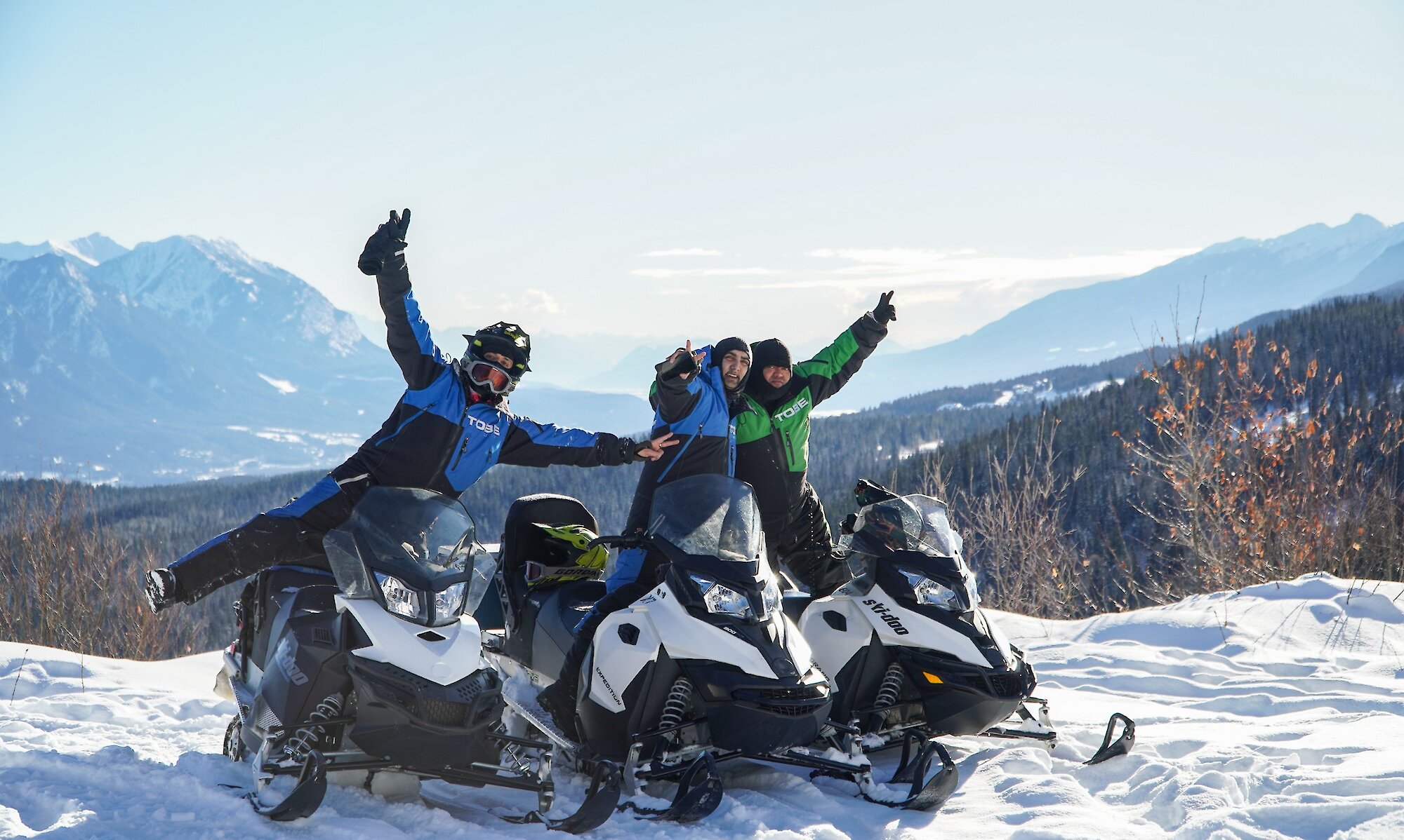 A group of friends enjoying snowmobiling in Golden, BC