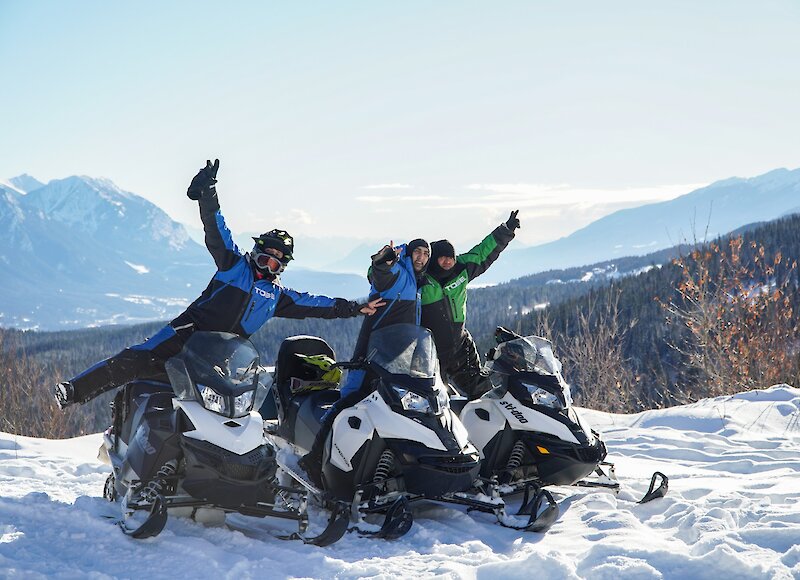 A group of friends enjoying snowmobiling in Golden, BC