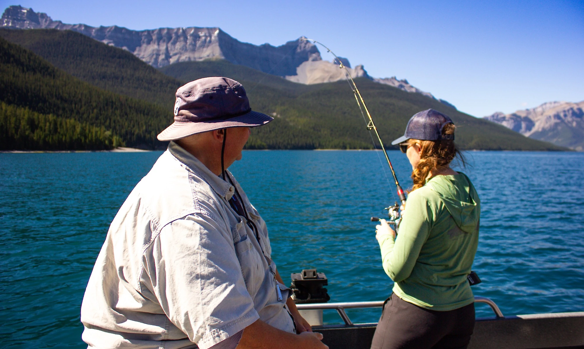 A guide and guest fishing on Lake Minnewanka