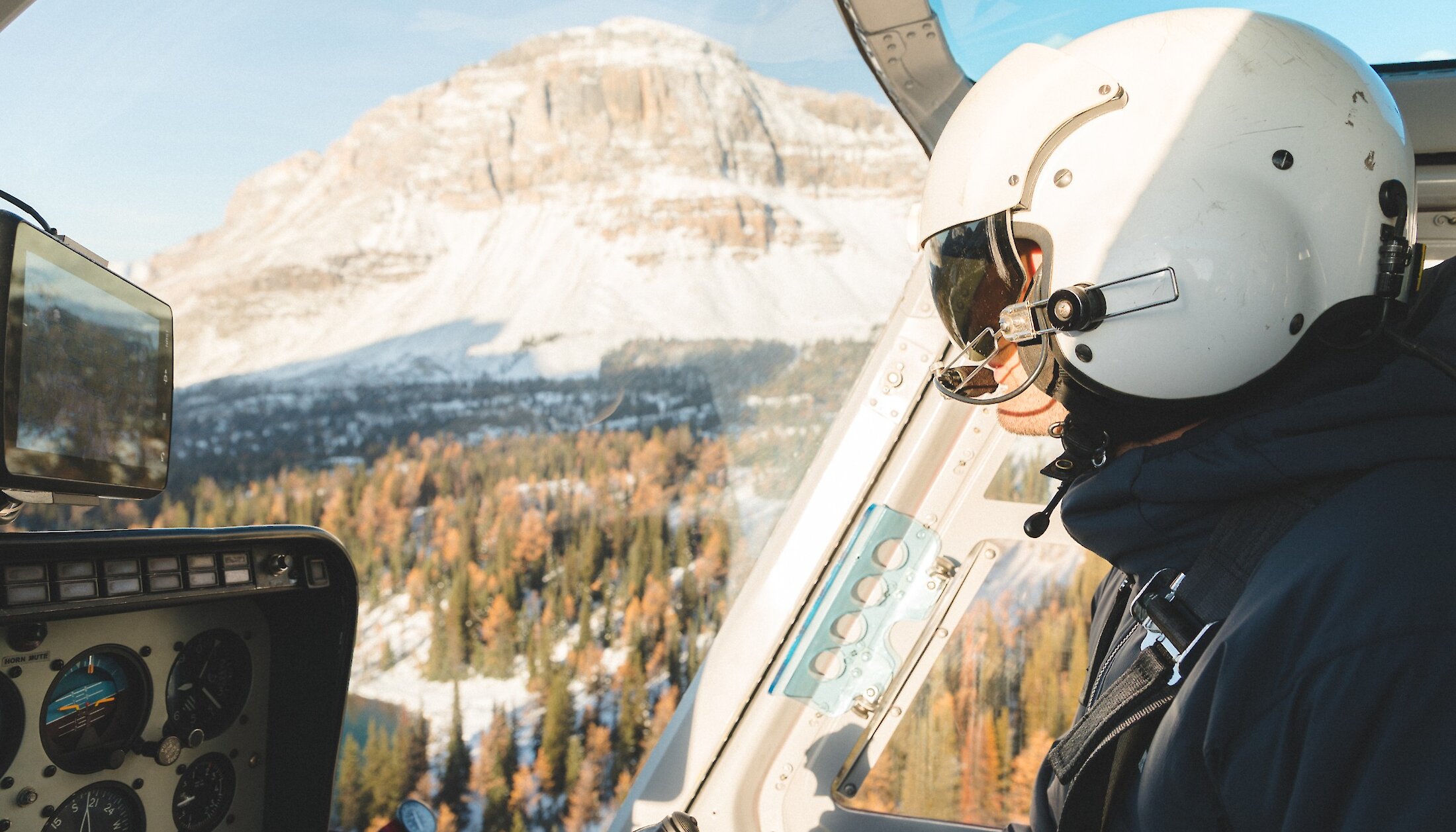 Pilot steering the helicopter from Canmore