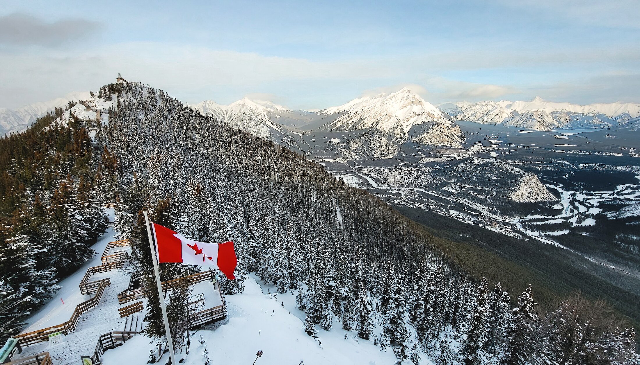 A view of Banff town from the upper terminal at the Banff Gondola with the Canadian flag