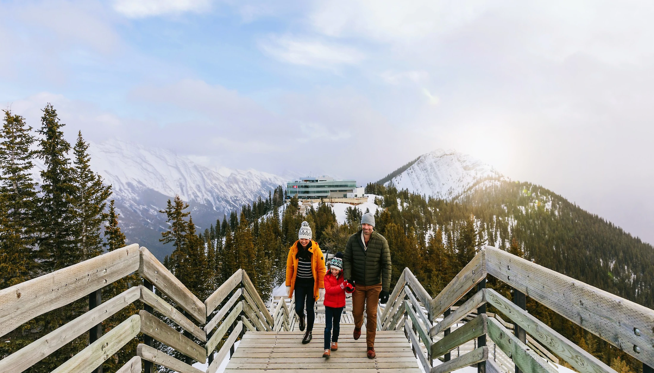 A family walking on the board walks at Banff Gondola