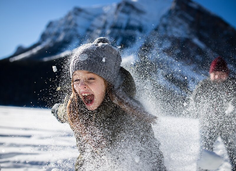 Two children playing on Lake Louise