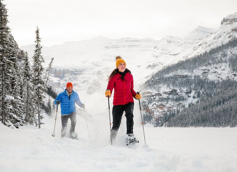 A couple of friends snowshoeing on Lake Louise