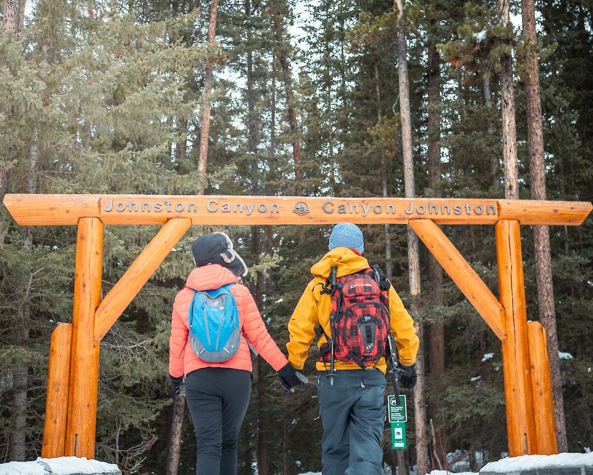 A couple walking towards Johnston Canton trailhead.