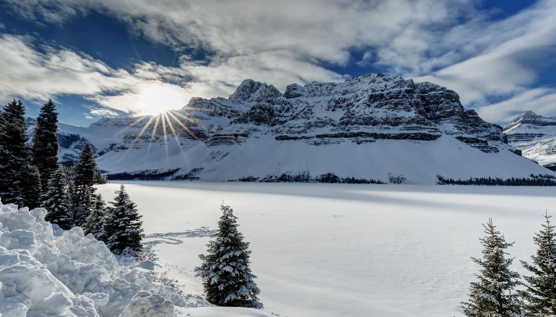 A view of frozen and snow covered Bow Lake on the Icefield Parkway