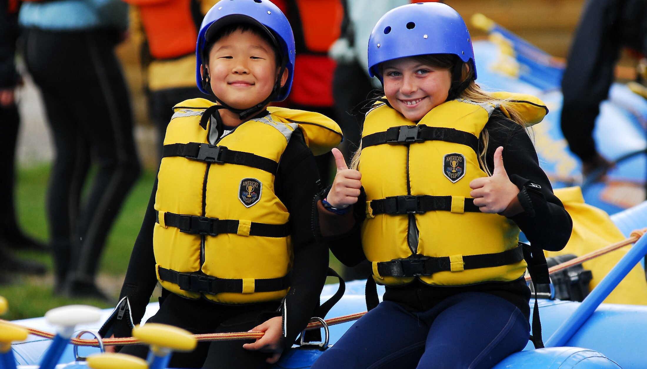Kids enjoying rafting on Kicking Horse River