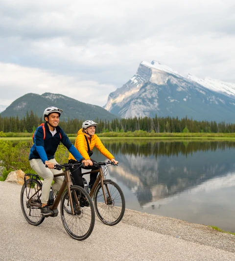 Bike riding in Banff National Park with views of Mount Rundle