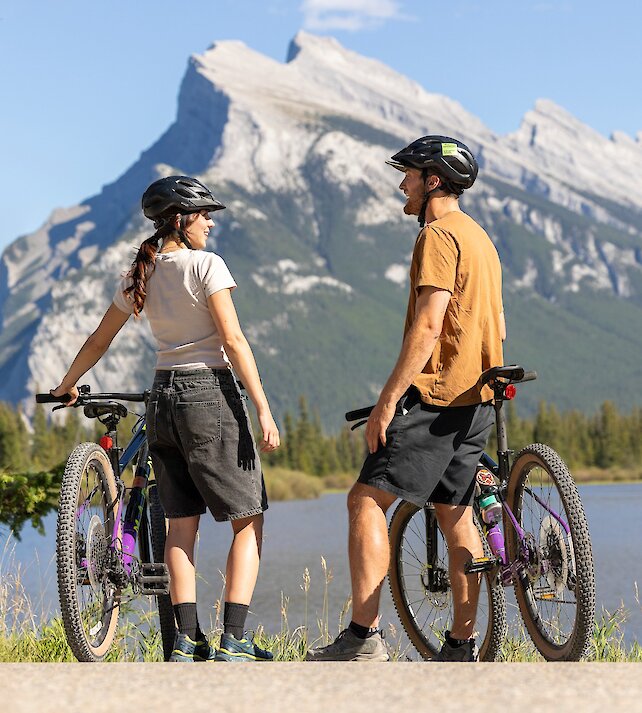 Bike riding in Banff National Park with views of Mount Rundle