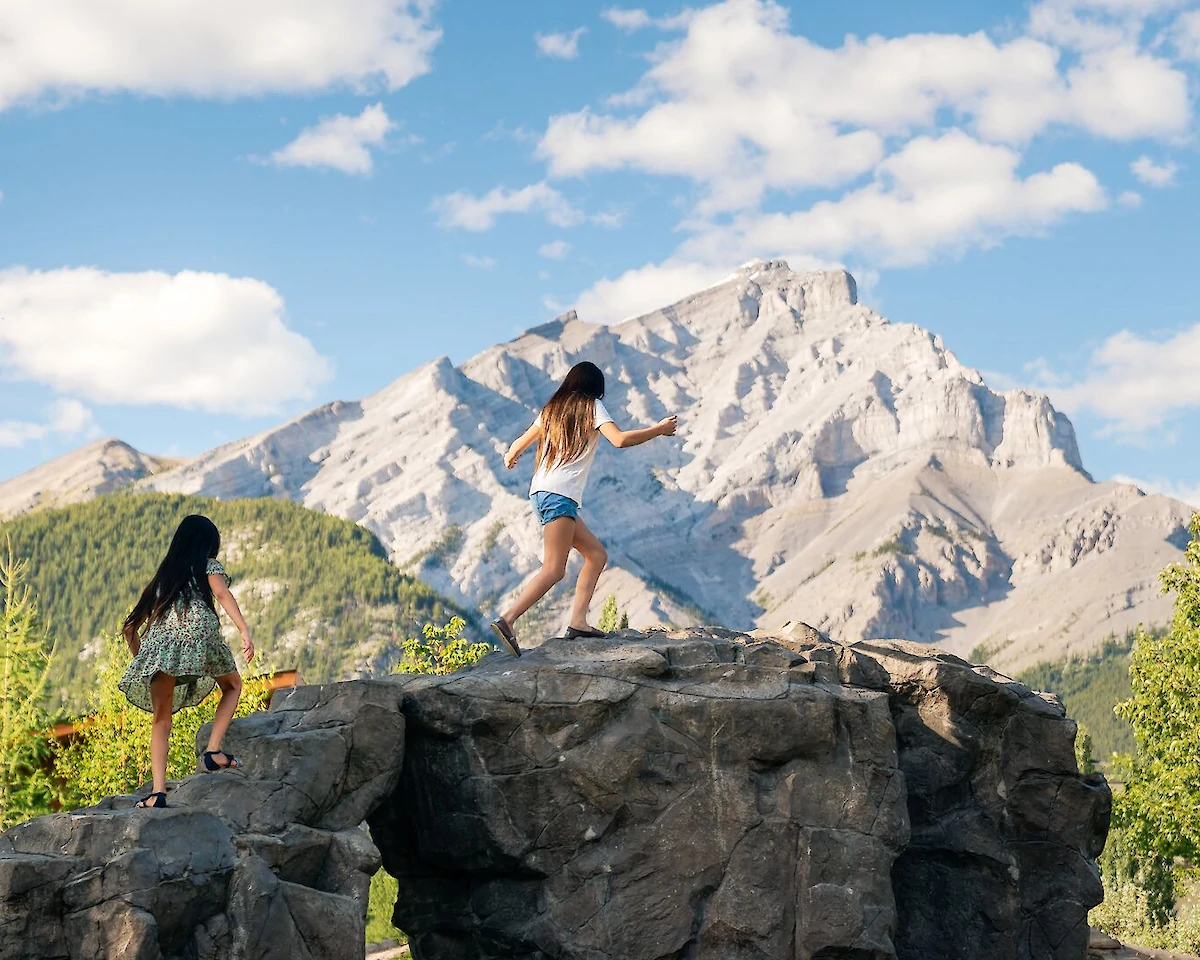 Kid playing in Central Park in Banff