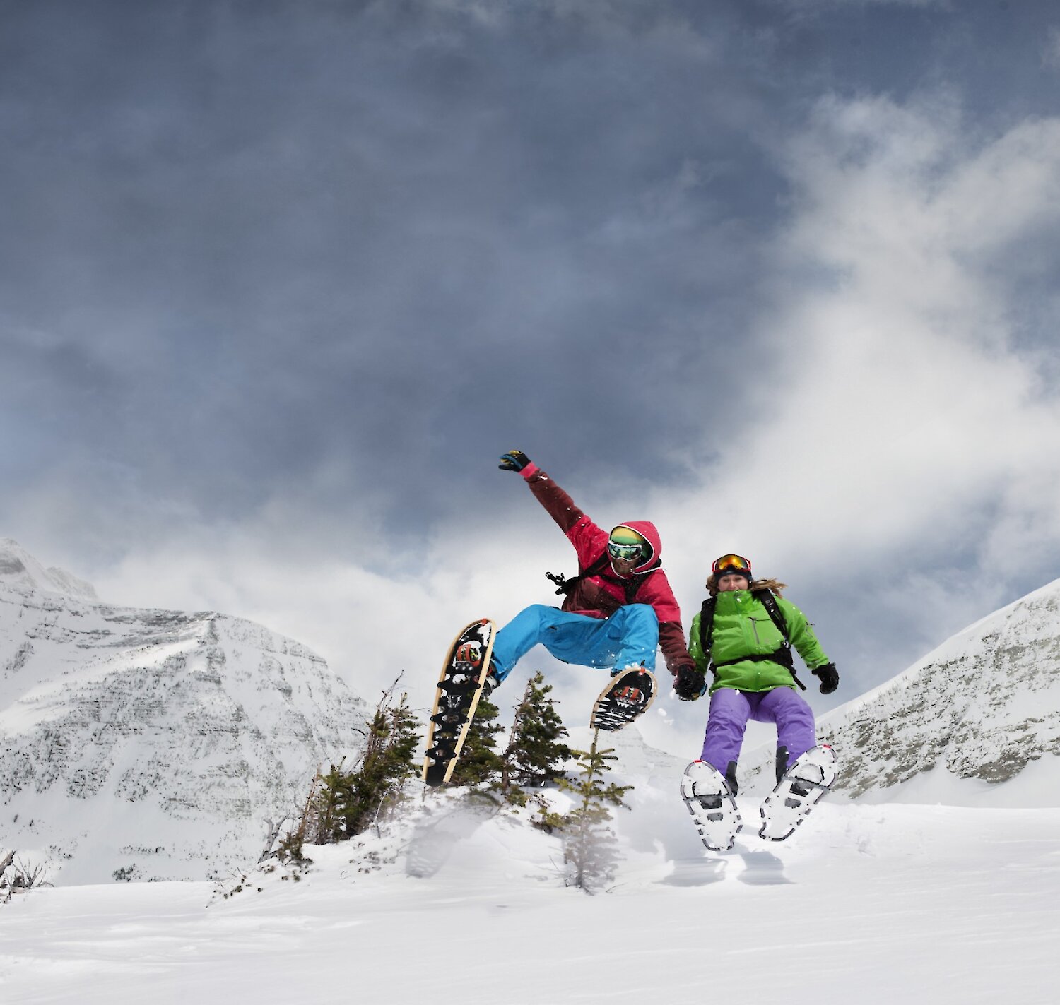 Two guests enjoying snowshoe rentals in Banff National Park