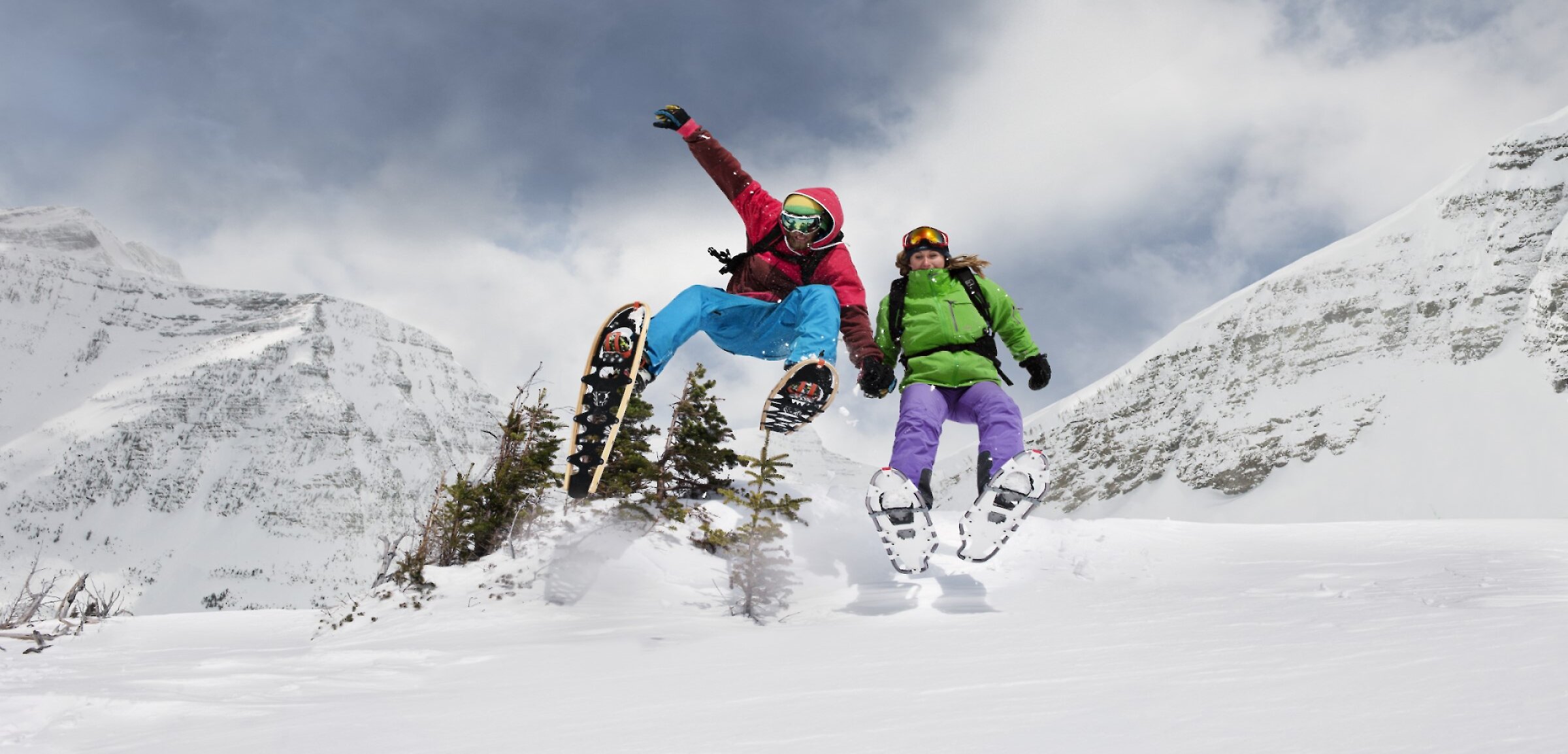 Two guests enjoying snowshoe rentals in Banff National Park