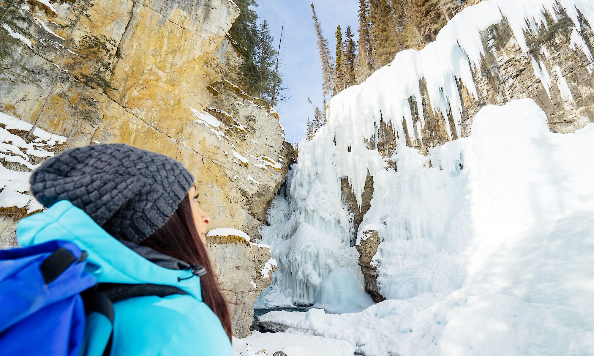Woman admiring the icefalls at Johnston Canyon