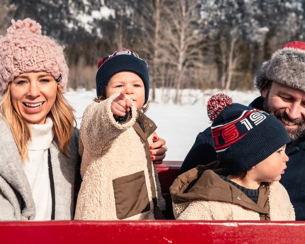 Family enjoying a Sleigh ride in Banff