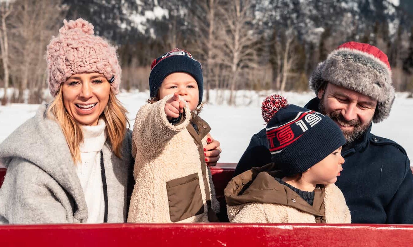 Family enjoying a Sleigh ride in Banff