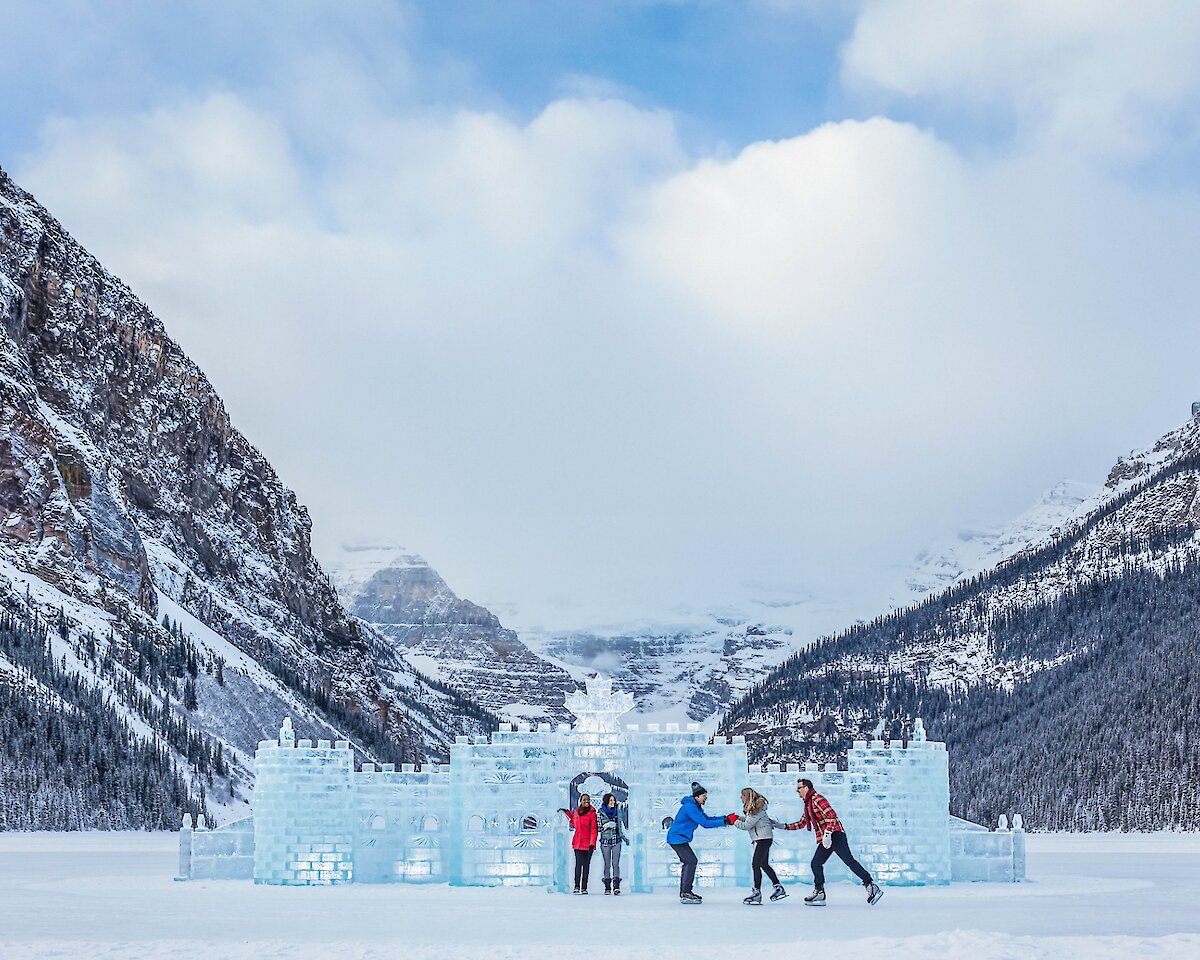 Skaters on Lake Louise in front of the Ice Castle